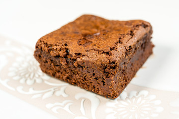 Chocolate Brownie cake on a dark plate