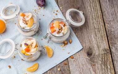 Healthy breakfast overnight oats with fresh fruit in a glass jar