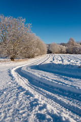 Obraz premium Snowy road in winter time.