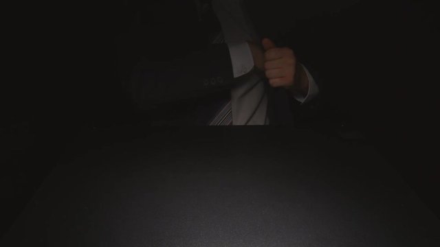 Bribe: Businessman waits and takes out a money from a pocket of a suit (euro)