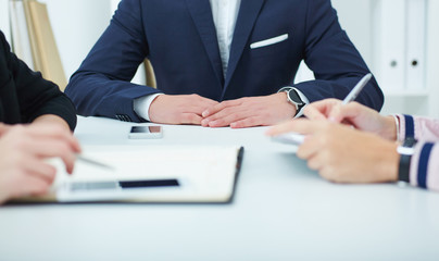 Young business people at a conference in the office.