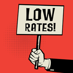 Poster in hand, business concept with text Low Rates