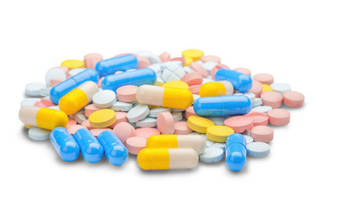 large pile of multicolored tablets and pills medically