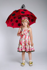 little girl with umbrella on white