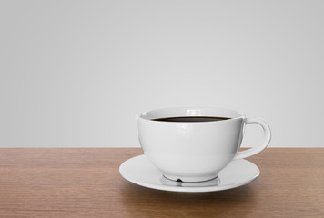 white coffee cup and hot espresso coffee on wooden table. light grey background