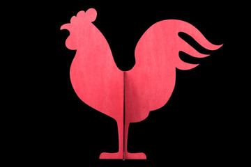 Wooden rooster isolated on black background