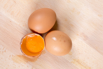 Flat lay eggs on the table yolk wooden table