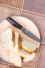 Flat lay overview sliced bread on the wooden board