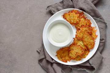 Latkes with sour cream, traditional Hanukkah dish