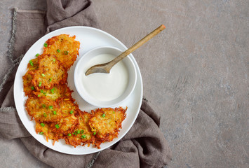 Latkes with sour cream, traditional Hanukkah dish