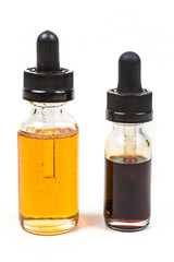 Fresh and expired discolored vape juice isolated on white background