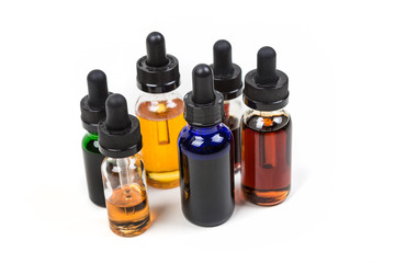 Assorted flavors of vape juice isolated on white background