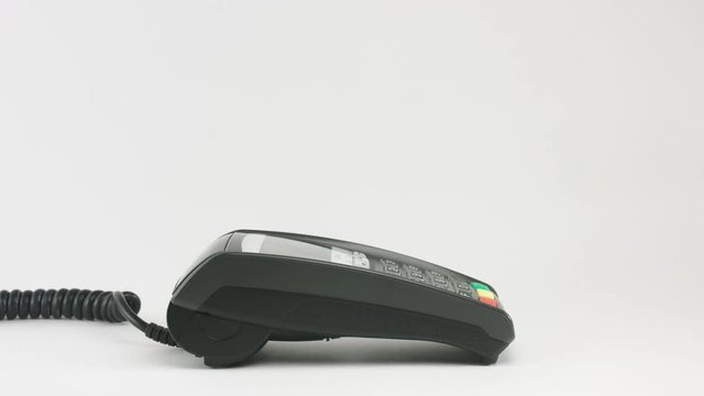 Crop of female finger enter pin code at payment terminal