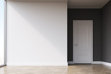 Empty room with white walls and light wood floor