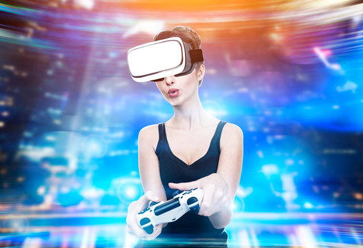 Girl in vr glasses holds controller playing game