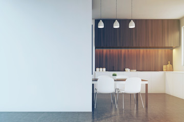 Kitchen with dark wood furniture, blank wall toned