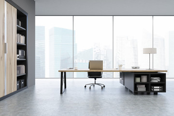 View of a CEO office with wooden doors and a bookcase