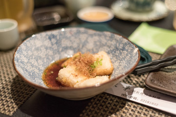 Fried tofu in bowl in japanese restaurant