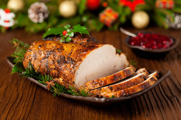 Roast pork loin with Christmas decoration. - obrazy, fototapety, plakaty