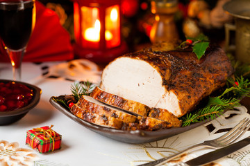 Roast pork loin with Christmas decoration.