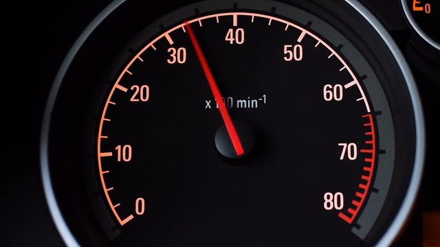 Car tachometer and moving pointer on it.