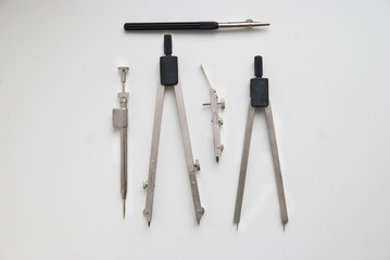 drawing engineering tools on a white surface