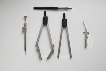 drawing engineering tools on a white surface