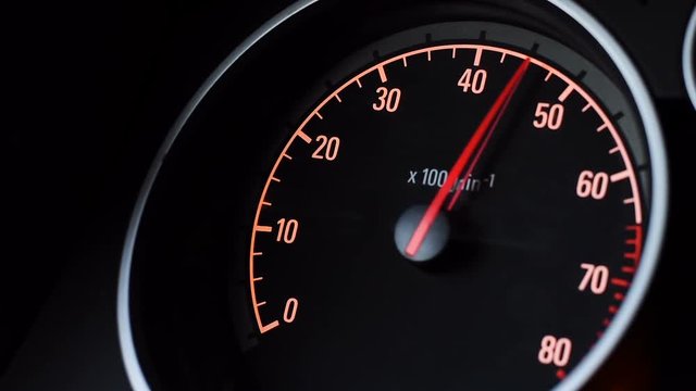 Car tachometer and moving pointer on it.