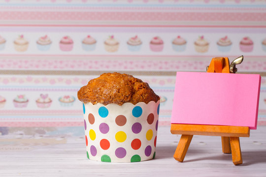 homemade muffins in colorful holders on the day of the birthday celebration. Kapka for children and women. blank sheet for writing your text