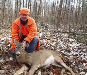 Wisconsin deer hunter with a buck