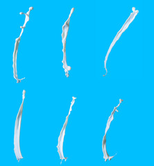 splashes of milk on a blue background. Collage