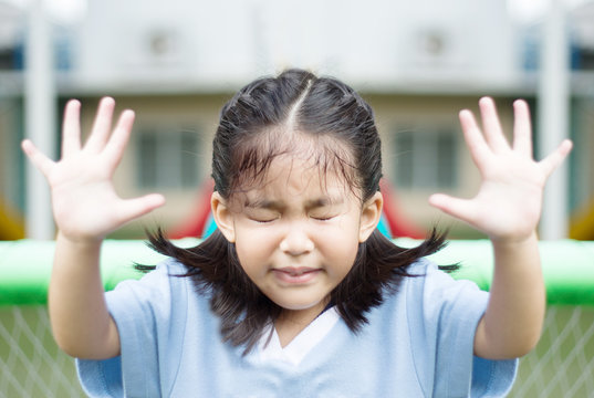close up emotion face of asian girl in park