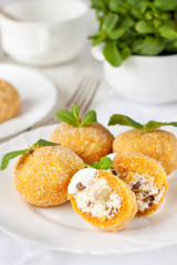 Pumpkin dumplings (knodel) filled with cottage cheese