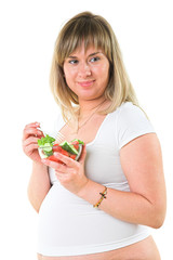 pregnant woman eating vegetables