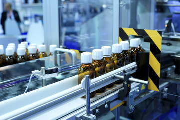 Factory for the production of medicines, glass bottles on the conveyor
