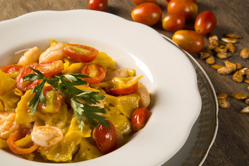 Pumpkin farfalle with shrimp and cherry tomato