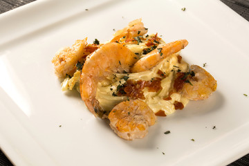 Pasta with shrimps served thyme and cheese