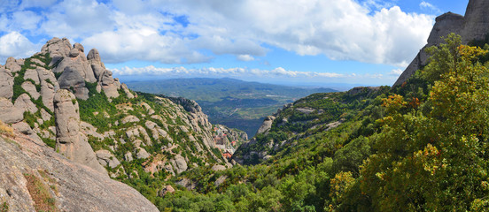 Montserrat  - multi-peaked rocky range located near the city of Barcelona in Catalonia, Spain.
