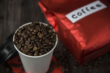 big red packaging of coffee and a cup of espresso