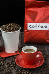 big red packaging of coffee and a cup of espresso