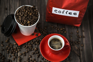 big red packaging of coffee and a cup of espresso
