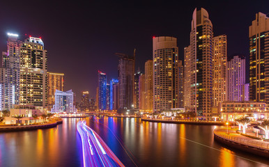 Fototapeta premium Busy promenade and the bay in Dubai Marina in the evening,Dubai,
