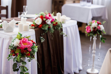 Vintage table decorated with flowers for the wedding ceremony.