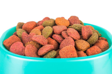 Dry dog treats in bowl isolated on white