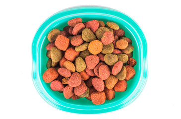 Dry dog treats in bowl isolated on white