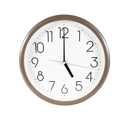 Brown wall clock isolated on white background.Wall clock at five
