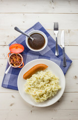 Typical dutch dish zuurkool with sauerkraut, smoked sausage and