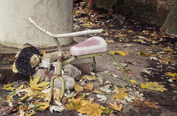 Broken bicycle in abandoned kindergarten. Chernobyl alienation zone.