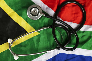 Medical stethoscope on South African flag