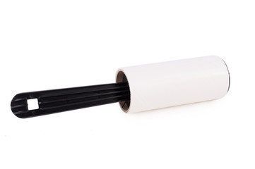 Adhesive roller for cleaning clothes from animal fur and hair isolated on white